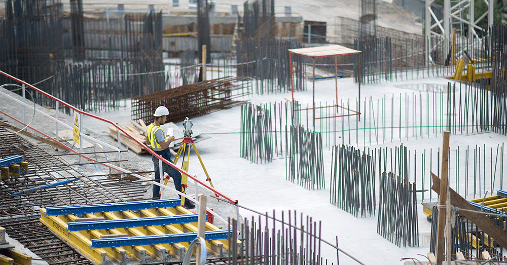 Engineer on site. Different building materials on site